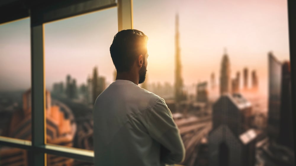 An entrepreneur gazing at the Dubai Skyline