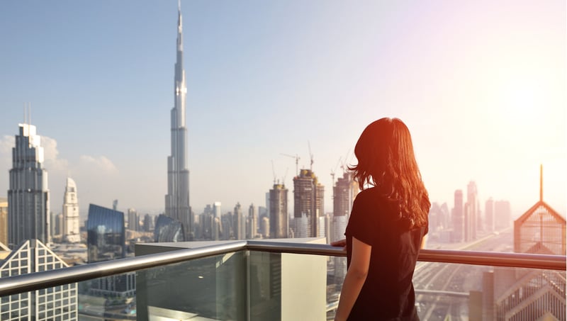 Woman overlooking the cityscape of Dubai