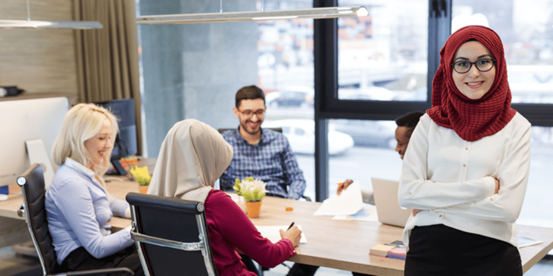 Businesspeople Meeting Around Table In Office