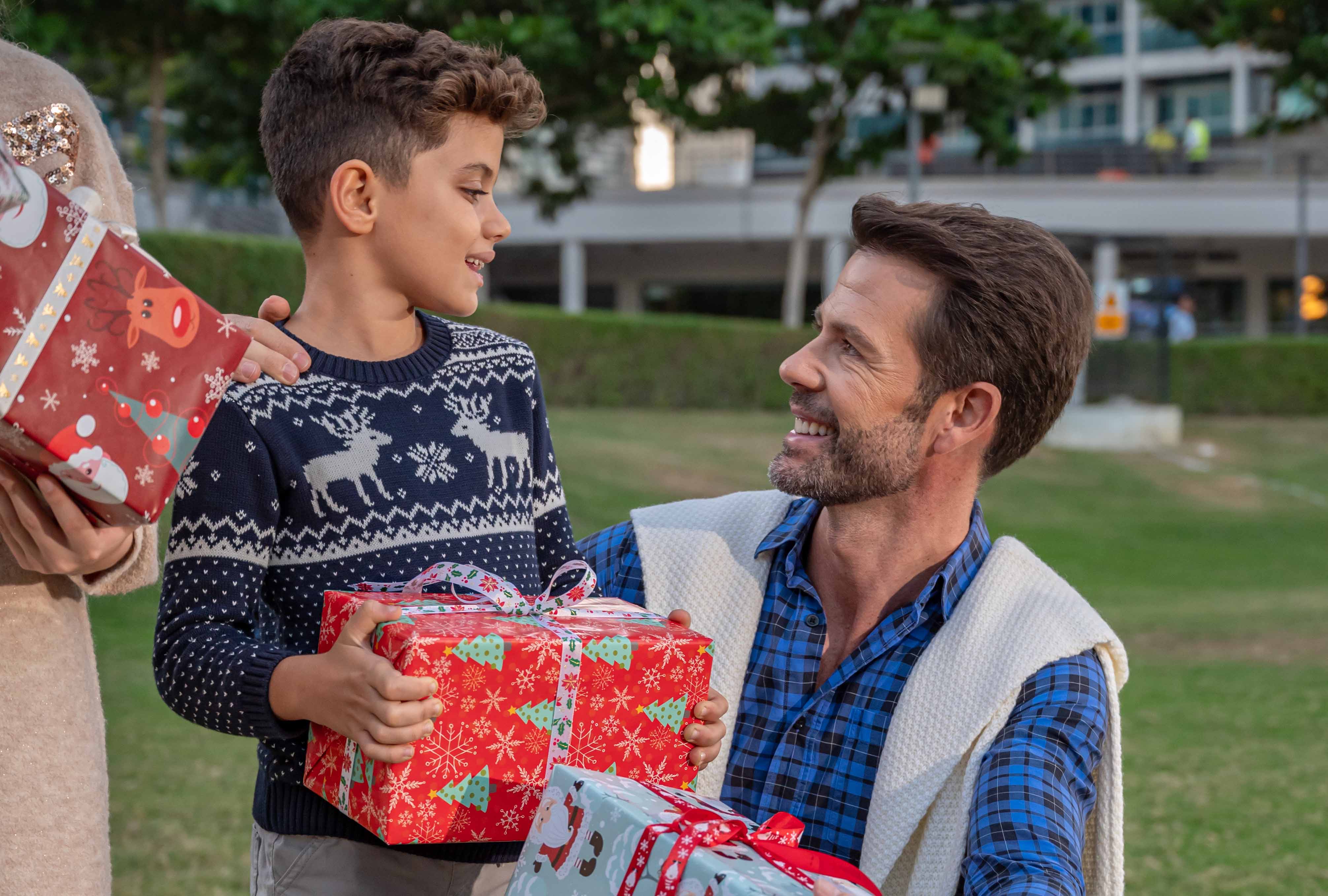 father and son with christmas presents