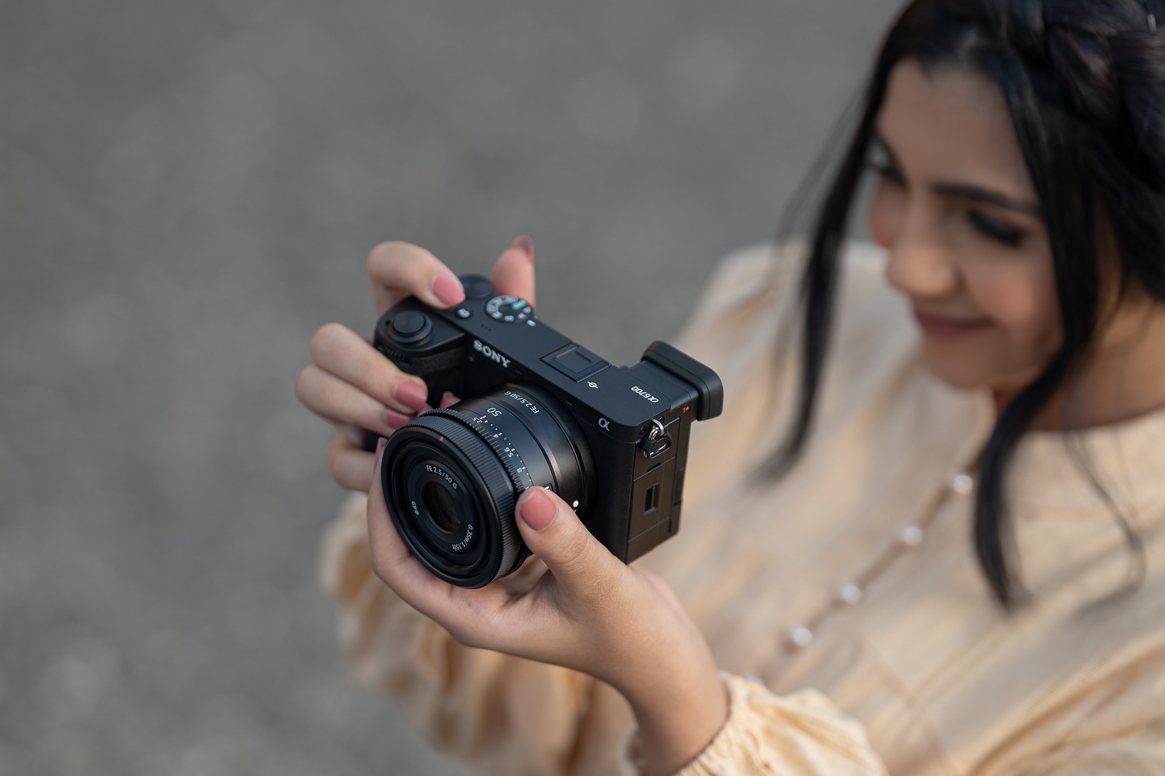 woman taking a picture on her sony camera